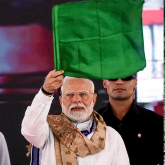 Amrit Bharat Express train at modern Indian station with celebration