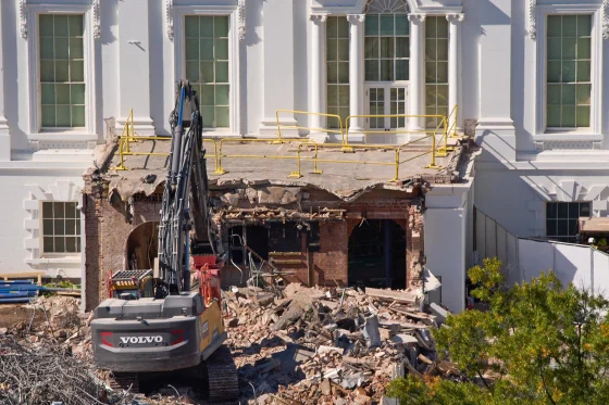 White House East Wing demolition site with construction equipment amid rubble