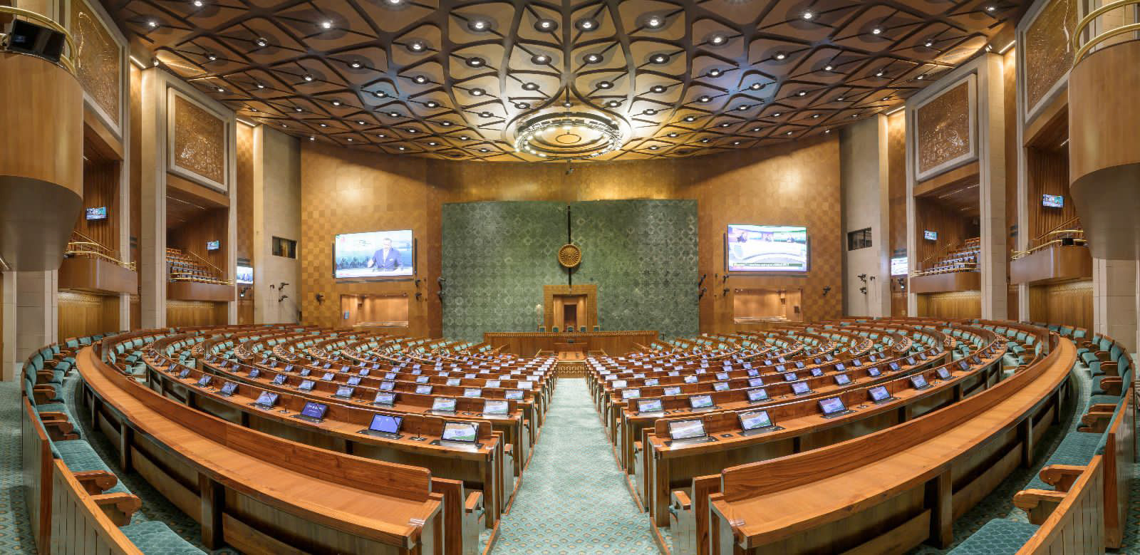 Wide shot of the Indian Parliament in session with MPs seated in the Lok Sabha chamber