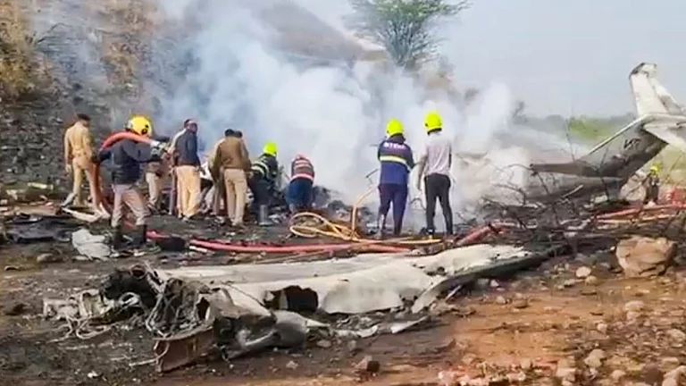Smoldering wreckage of Learjet at Baramati airport after Ajit Pawar crash