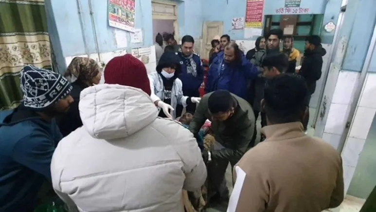 Illustrative image showing night-time village road and pond in Bangladesh with police lights in the background