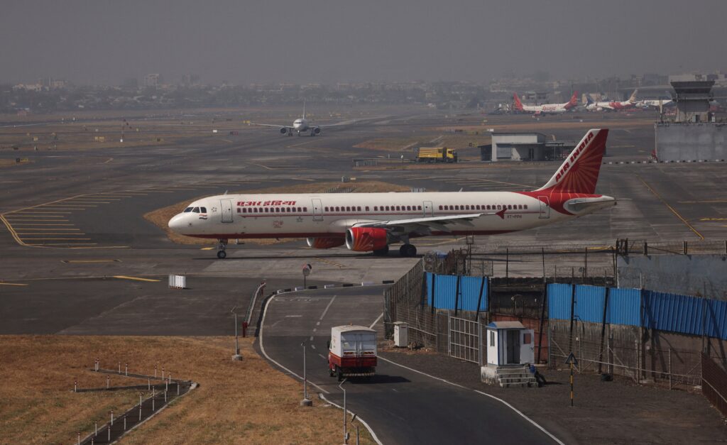 Air India jets on the apron as rising fuel costs force a hike in surcharges.