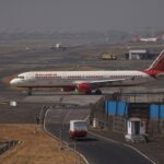 Air India jets on the apron as rising fuel costs force a hike in surcharges.