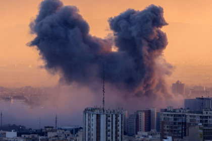 Flames and smoke rising from Tehran skyline after Israeli airstrikes on IRGC headquarters March 2026