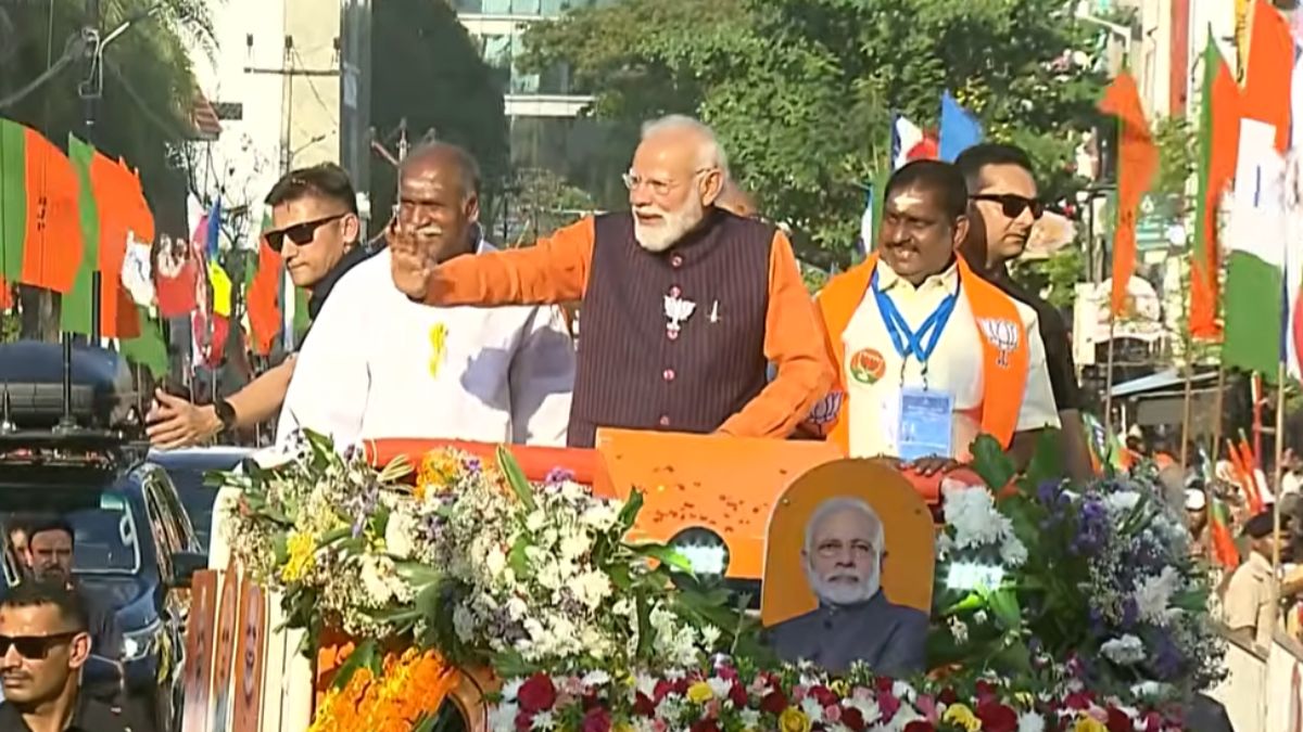 Prime Minister Narendra Modi waves to supporters during Puducherry roadshow ahead of Assembly elections 2026